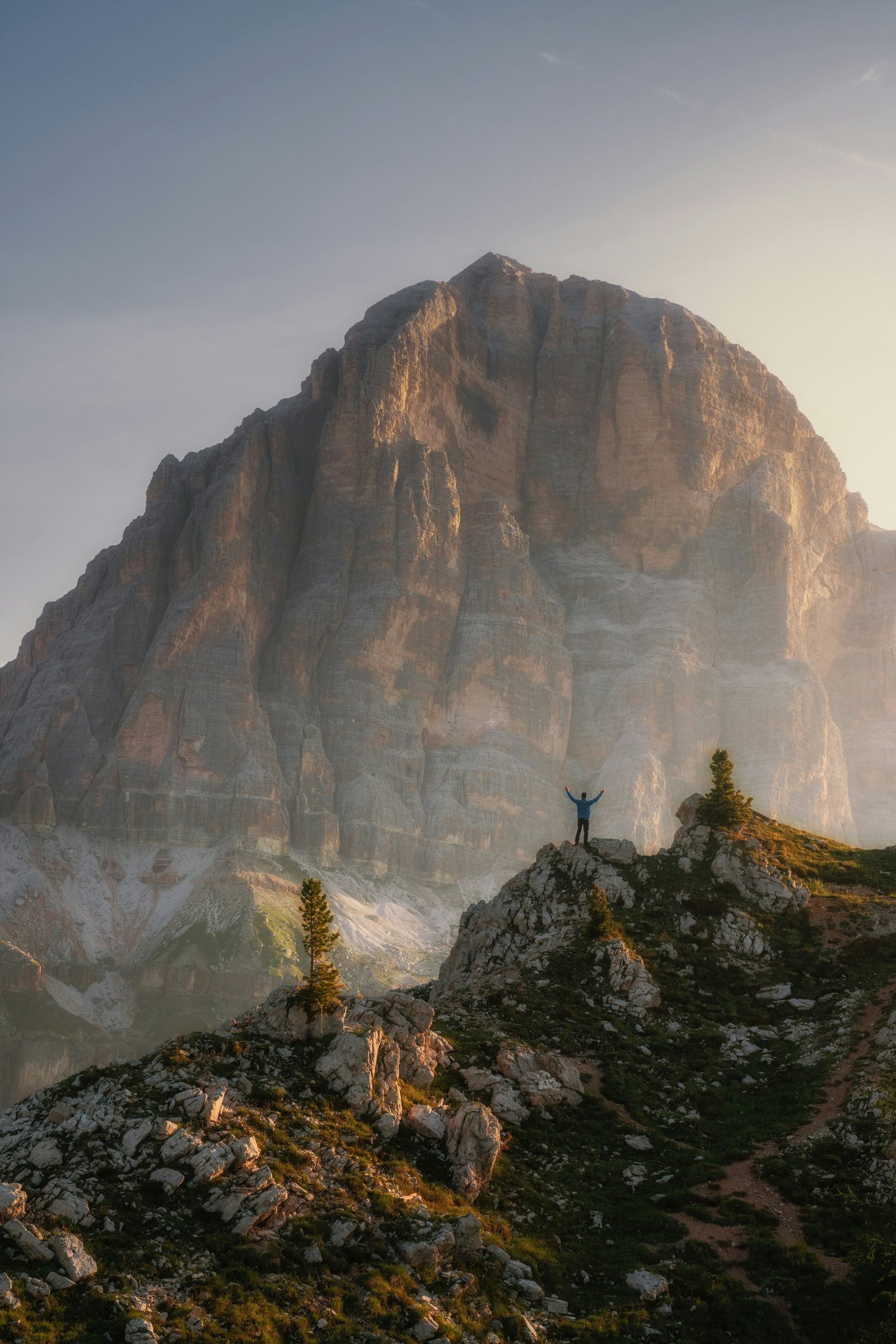 Hiker celebrating on a mountain ridge